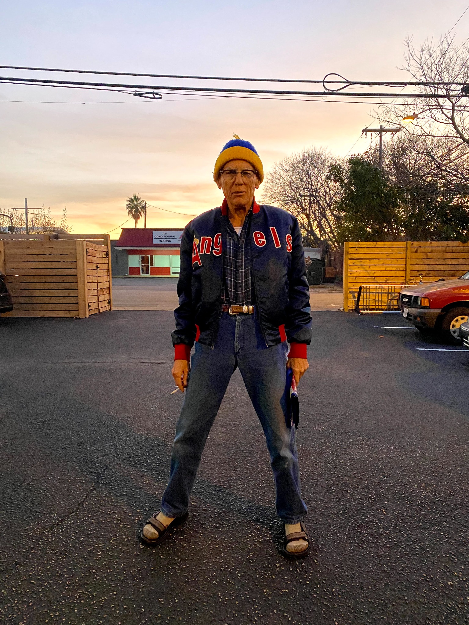 David standing in an Austin parking lot at sunset
